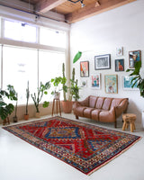 Vintage Turkish rug in a living room setting, pile rug, Turkish rug, vintage rug, portland, rug shop, bright colors, wild shaman, soft rug, bold color, Portland, Oregon, rug store, rug shop, local shop, antique rug