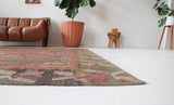Vintage kilim rug in living room setting, old rug, antique rug, pastel colors, faded colors, Turkish rug, vintage rug, soft rug, Portland, Oregon, rug store, rug shop, local shop