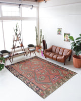 Vintage kilim rug in living room setting, old rug, antique rug, pastel colors, faded colors, Turkish rug, vintage rug, soft rug, Portland, Oregon, rug store, rug shop, local shop