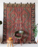 Vintage kilim rug in living room setting, old rug, antique rug, pastel colors, faded colors, Turkish rug, vintage rug, soft rug, Portland, Oregon, rug store, rug shop, local shop