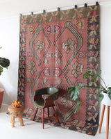 Vintage kilim rug in living room setting, old rug, antique rug, pastel colors, faded colors, Turkish rug, vintage rug, soft rug, Portland, Oregon, rug store, rug shop, local shop