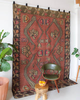 Vintage kilim rug in living room setting, old rug, antique rug, pastel colors, faded colors, Turkish rug, vintage rug, soft rug, Portland, Oregon, rug store, rug shop, local shop