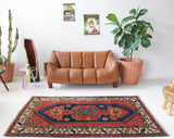 Vintage caucasian rug in a living room setting, pile rug, Turkish rug, vintage rug, portland, rug shop, bright colors, wild shaman, soft rug, bold color, Portland, Oregon, rug store, rug shop, local shop, antique rug