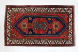Vintage caucasian rug in a living room setting, pile rug, Turkish rug, vintage rug, portland, rug shop, bright colors, wild shaman, soft rug, bold color, Portland, Oregon, rug store, rug shop, local shop, antique rug