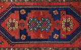 Vintage caucasian rug in a living room setting, pile rug, Turkish rug, vintage rug, portland, rug shop, bright colors, wild shaman, soft rug, bold color, Portland, Oregon, rug store, rug shop, local shop, antique rug
