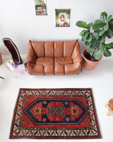 Vintage caucasian rug in a living room setting, pile rug, Turkish rug, vintage rug, portland, rug shop, bright colors, wild shaman, soft rug, bold color, Portland, Oregon, rug store, rug shop, local shop, antique rug