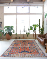 Vintage Turkish rug in living room setting, old rug, antique rug, pastel colors, faded colors, Turkish rug, vintage rug, soft rug, Portland, Oregon, rug store, rug shop, local shop