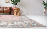 Vintage Turkish rug in living room setting, old rug, antique rug, pastel colors, faded colors, Turkish rug, vintage rug, soft rug, Portland, Oregon, rug store, rug shop, local shop