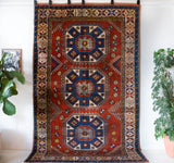 Vintage Turkish rug in a living room setting, pile rug, Turkish rug, vintage rug, portland, rug shop, bright colors, wild shaman, soft rug, bold color, Portland, Oregon, rug store, rug shop, local shop, antique rug