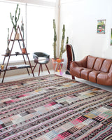 Vintage kilim rug in room decor setting, old rug, antique rug, pastel colors, faded colors, Turkish rug, vintage rug, soft rug, Portland, Oregon, rug store, rug shop, local shop, distressed rug, worn out rug