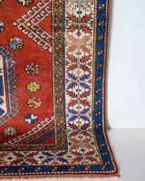 Vintage Turkish rug in a living room setting, pile rug, Turkish rug, vintage rug, portland, rug shop, bright colors, wild shaman, soft rug, bold color, Portland, Oregon, rug store, rug shop, local shop, antique rug