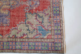 Vintage Turkish  rug in a living room setting, pile rug, Turkish rug, vintage rug, portland, rug shop, bright colors, wild shaman, soft rug, bold color, Portland, Oregon, rug store, rug shop, local shop, antique rug, distressed rug, worn out rug