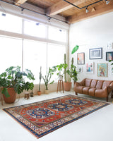 Vintage Turkish rug in a living room setting, pile rug, Turkish rug, vintage rug, portland, rug shop, bright colors, wild shaman, soft rug, bold color, Portland, Oregon, rug store, rug shop, local shop, antique rug