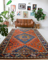 Vintage Turkish rug in a living room setting, pile rug, Turkish rug, vintage rug, portland, rug shop, bright colors, wild shaman, soft rug, bold color, Portland, Oregon, rug store, rug shop, local shop, antique rug