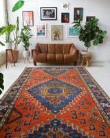 Vintage Turkish rug in a living room setting, pile rug, Turkish rug, vintage rug, portland, rug shop, bright colors, wild shaman, soft rug, bold color, Portland, Oregon, rug store, rug shop, local shop, antique rug