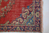 Vintage Turkish  rug in a living room setting, pile rug, Turkish rug, vintage rug, portland, rug shop, bright colors, wild shaman, soft rug, bold color, Portland, Oregon, rug store, rug shop, local shop, antique rug, distressed rug, worn out rug