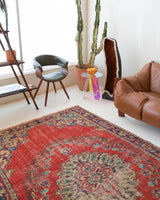 Vintage Turkish  rug in a living room setting, pile rug, Turkish rug, vintage rug, portland, rug shop, bright colors, wild shaman, soft rug, bold color, Portland, Oregon, rug store, rug shop, local shop, antique rug, distressed rug, worn out rug