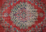 Vintage Turkish  rug in a living room setting, pile rug, Turkish rug, vintage rug, portland, rug shop, bright colors, wild shaman, soft rug, bold color, Portland, Oregon, rug store, rug shop, local shop, antique rug, distressed rug, worn out rug