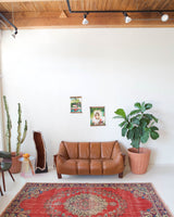 Vintage Turkish  rug in a living room setting, pile rug, Turkish rug, vintage rug, portland, rug shop, bright colors, wild shaman, soft rug, bold color, Portland, Oregon, rug store, rug shop, local shop, antique rug, distressed rug, worn out rug