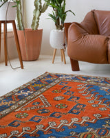 Vintage Turkish rug in a living room setting, pile rug, Turkish rug, vintage rug, portland, rug shop, bright colors, wild shaman, soft rug, bold color, Portland, Oregon, rug store, rug shop, local shop, antique rug