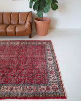 Vintage Turkish  rug in a living room setting, pile rug, Turkish rug, vintage rug, portland, rug shop, bright colors, wild shaman, soft rug, bold color, Portland, Oregon, rug store, rug shop, local shop, antique rug, distressed rug, worn out rug