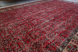 Vintage Turkish  rug in a living room setting, pile rug, Turkish rug, vintage rug, portland, rug shop, bright colors, wild shaman, soft rug, bold color, Portland, Oregon, rug store, rug shop, local shop, antique rug, distressed rug, worn out rug