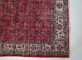 Vintage Turkish  rug in a living room setting, pile rug, Turkish rug, vintage rug, portland, rug shop, bright colors, wild shaman, soft rug, bold color, Portland, Oregon, rug store, rug shop, local shop, antique rug, distressed rug, worn out rug