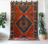 Vintage Turkish rug in a living room setting, pile rug, Turkish rug, vintage rug, portland, rug shop, bright colors, wild shaman, soft rug, bold color, Portland, Oregon, rug store, rug shop, local shop, antique rug
