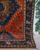 Vintage Turkish rug in a living room setting, pile rug, Turkish rug, vintage rug, portland, rug shop, bright colors, wild shaman, soft rug, bold color, Portland, Oregon, rug store, rug shop, local shop, antique rug