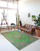 Vintage Turkish  rug in a living room setting, pile rug, Turkish rug, vintage rug, portland, rug shop, bright colors, wild shaman, soft rug, bold color, Portland, Oregon, rug store, rug shop, local shop, antique rug, distressed rug, worn out rug