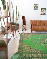 Vintage Turkish  rug in a living room setting, pile rug, Turkish rug, vintage rug, portland, rug shop, bright colors, wild shaman, soft rug, bold color, Portland, Oregon, rug store, rug shop, local shop, antique rug, distressed rug, worn out rug