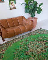 Vintage Turkish  rug in a living room setting, pile rug, Turkish rug, vintage rug, portland, rug shop, bright colors, wild shaman, soft rug, bold color, Portland, Oregon, rug store, rug shop, local shop, antique rug, distressed rug, worn out rug