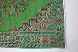 Vintage Turkish  rug in a living room setting, pile rug, Turkish rug, vintage rug, portland, rug shop, bright colors, wild shaman, soft rug, bold color, Portland, Oregon, rug store, rug shop, local shop, antique rug, distressed rug, worn out rug
