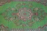 Vintage Turkish  rug in a living room setting, pile rug, Turkish rug, vintage rug, portland, rug shop, bright colors, wild shaman, soft rug, bold color, Portland, Oregon, rug store, rug shop, local shop, antique rug, distressed rug, worn out rug
