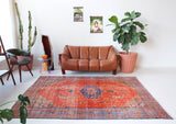 Vintage Turkish  rug in a living room setting, pile rug, Turkish rug, vintage rug, portland, rug shop, bright colors, wild shaman, soft rug, bold color, Portland, Oregon, rug store, rug shop, local shop, antique rug, distressed rug, worn out rug