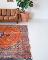 Vintage Turkish  rug in a living room setting, pile rug, Turkish rug, vintage rug, portland, rug shop, bright colors, wild shaman, soft rug, bold color, Portland, Oregon, rug store, rug shop, local shop, antique rug, distressed rug, worn out rug