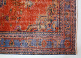 Vintage Turkish  rug in a living room setting, pile rug, Turkish rug, vintage rug, portland, rug shop, bright colors, wild shaman, soft rug, bold color, Portland, Oregon, rug store, rug shop, local shop, antique rug, distressed rug, worn out rug