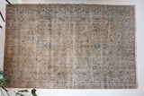 Vintage Turkish rug in living room setting, old rug, antique rug, pastel colors, faded colors, Turkish rug, vintage rug, soft rug, Portland, Oregon, rug store, rug shop, local shop