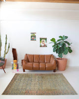 Vintage Turkish rug in living room setting, old rug, antique rug, pastel colors, faded colors, Turkish rug, vintage rug, soft rug, Portland, Oregon, rug store, rug shop, local shop