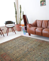 Vintage Turkish rug in living room setting, old rug, antique rug, pastel colors, faded colors, Turkish rug, vintage rug, soft rug, Portland, Oregon, rug store, rug shop, local shop