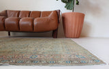 Vintage Turkish rug in living room setting, old rug, antique rug, pastel colors, faded colors, Turkish rug, vintage rug, soft rug, Portland, Oregon, rug store, rug shop, local shop