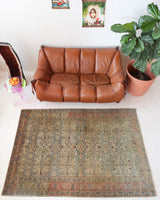 Vintage Turkish rug in living room setting, old rug, antique rug, pastel colors, faded colors, Turkish rug, vintage rug, soft rug, Portland, Oregon, rug store, rug shop, local shop