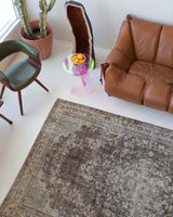Vintage Turkish rug in living room setting, old rug, antique rug, pastel colors, faded colors, Turkish rug, vintage rug, distressed rug, worn out rug, Portland, Oregon, rug store, rug shop, local shop