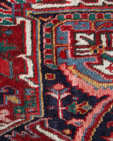 Antique Persian area rug in a living room setting, pile rug, vintage rug, portland, rug shop, bright colors, wild shaman, soft rug, bold color, Portland, Oregon, rug store, rug shop, local shop, antique rug, Persian rug, handmade rug, wool rug, distressed rug