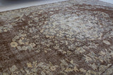 Vintage Turkish rug in living room setting, old rug, antique rug, pastel colors, faded colors, Turkish rug, vintage rug, distressed rug, worn out rug, Portland, Oregon, rug store, rug shop, local shop