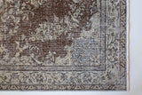 Vintage Turkish rug in living room setting, old rug, antique rug, pastel colors, faded colors, Turkish rug, vintage rug, distressed rug, worn out rug, Portland, Oregon, rug store, rug shop, local shop