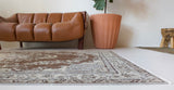 Vintage Turkish rug in living room setting, old rug, antique rug, pastel colors, faded colors, Turkish rug, vintage rug, distressed rug, worn out rug, Portland, Oregon, rug store, rug shop, local shop