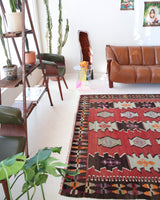 Vintage kilim rug in room decor setting, kilim, Turkish rug, vintage rug, portland, rug shop, bright colors, wild shaman, soft rug, bold color, Portland, Oregon, rug store, rug shop, local shop, antique rug