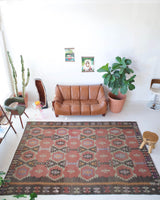 Vintage kilim rug in room decor setting, old rug, antique rug, pastel colors, faded colors, Turkish rug, vintage rug, soft rug, Portland, Oregon, rug store, rug shop, local shop, distressed rug, worn out rug