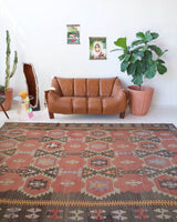 Vintage kilim rug in room decor setting, old rug, antique rug, pastel colors, faded colors, Turkish rug, vintage rug, soft rug, Portland, Oregon, rug store, rug shop, local shop, distressed rug, worn out rug